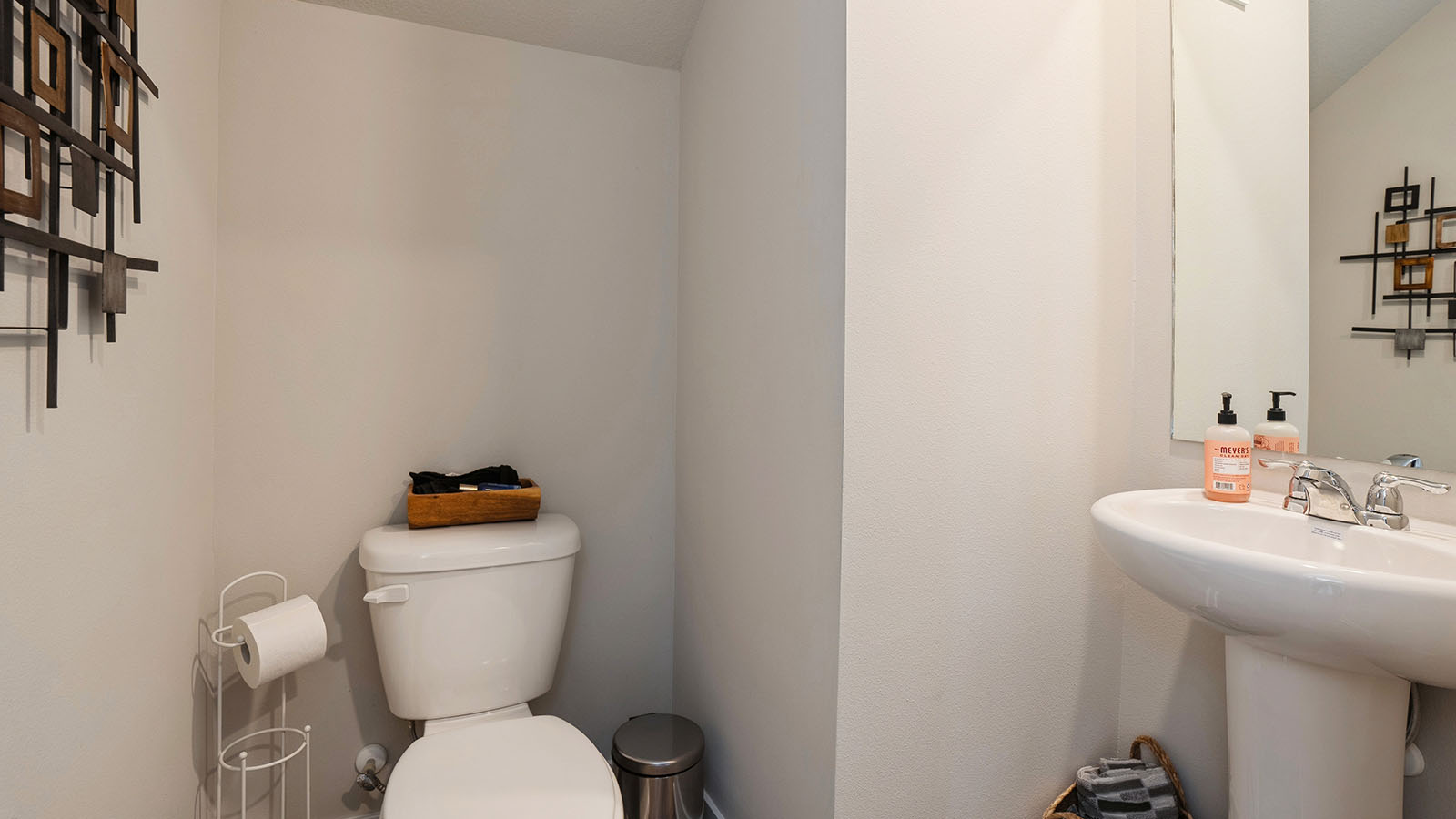 Convenient main-level powder room with updated fixtures and bright lighting.