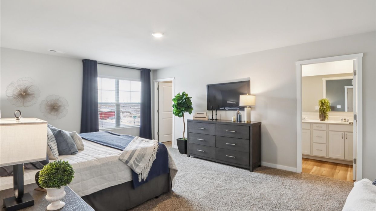 Primary bedroom with natural lighting and spacious layout