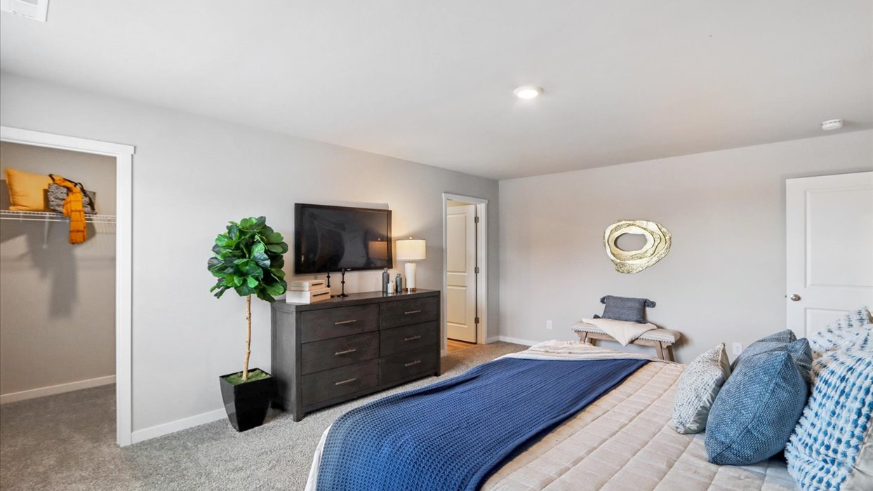 Primary bedroom with natural lighting and spacious layout
