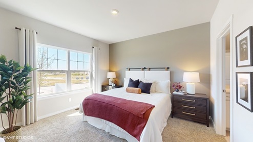 Bright primary bedroom with window