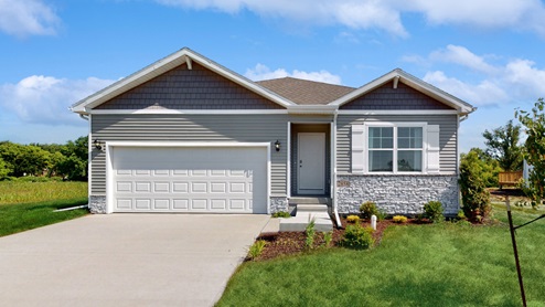 front exterior view of aldridge home with two car attached garage