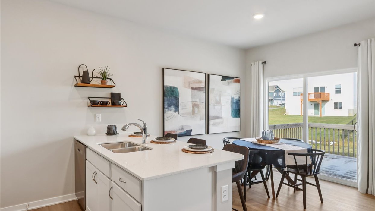 Aldridge kitchen and dining area with island and wood dining table