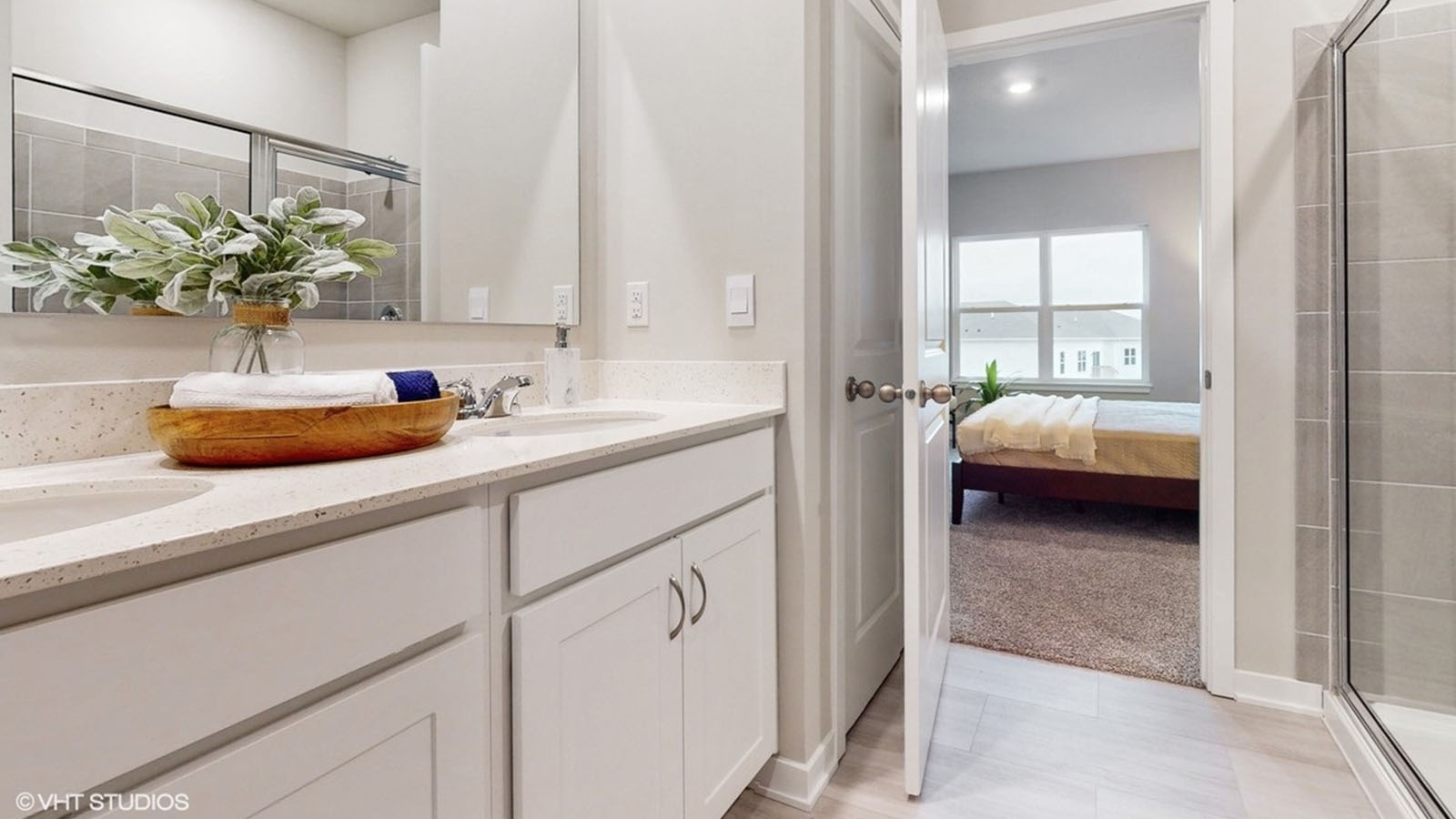 Primary bathroom with white cabinets