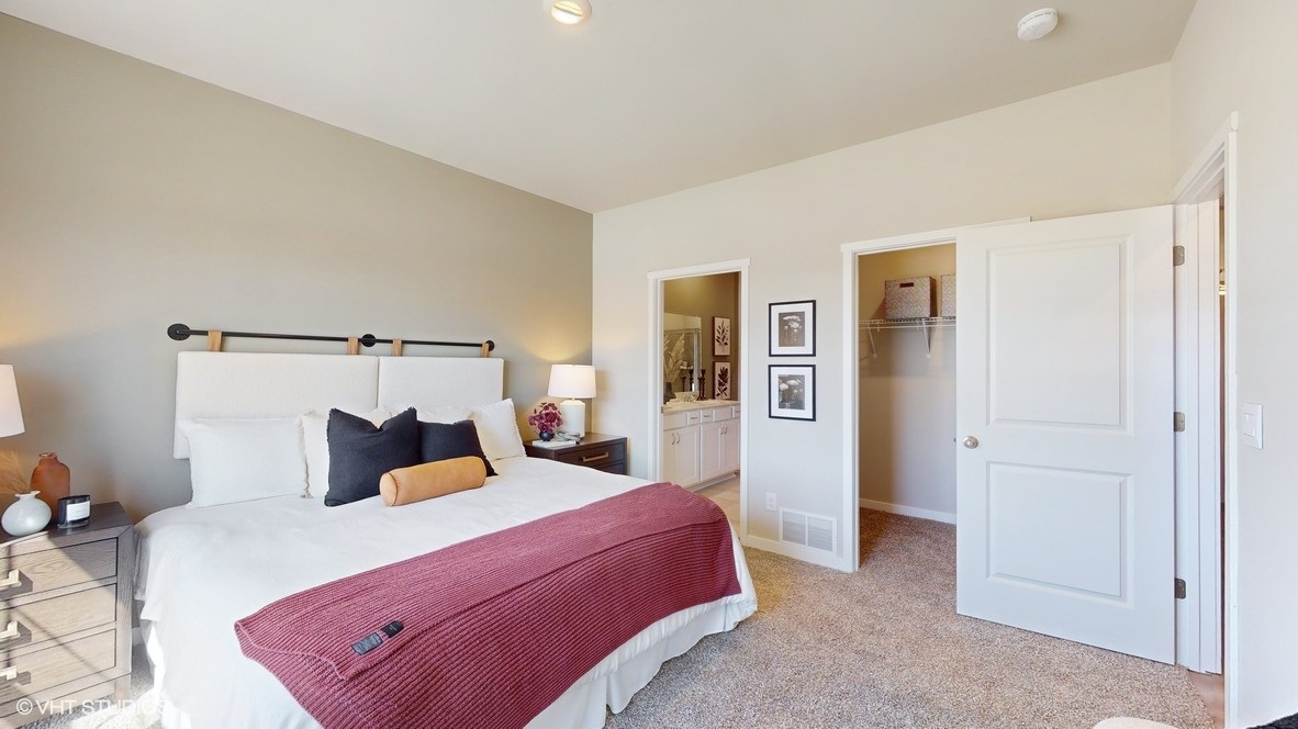 Primary bedroom with bathroom and closet