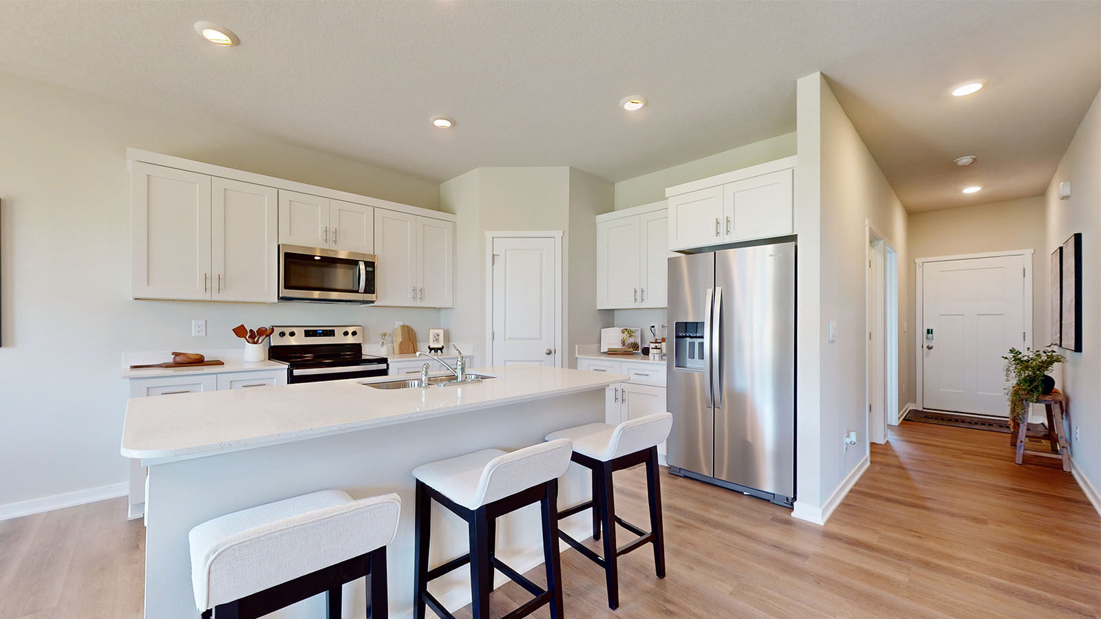 Kitchen with walk-in pantry and white cabinets