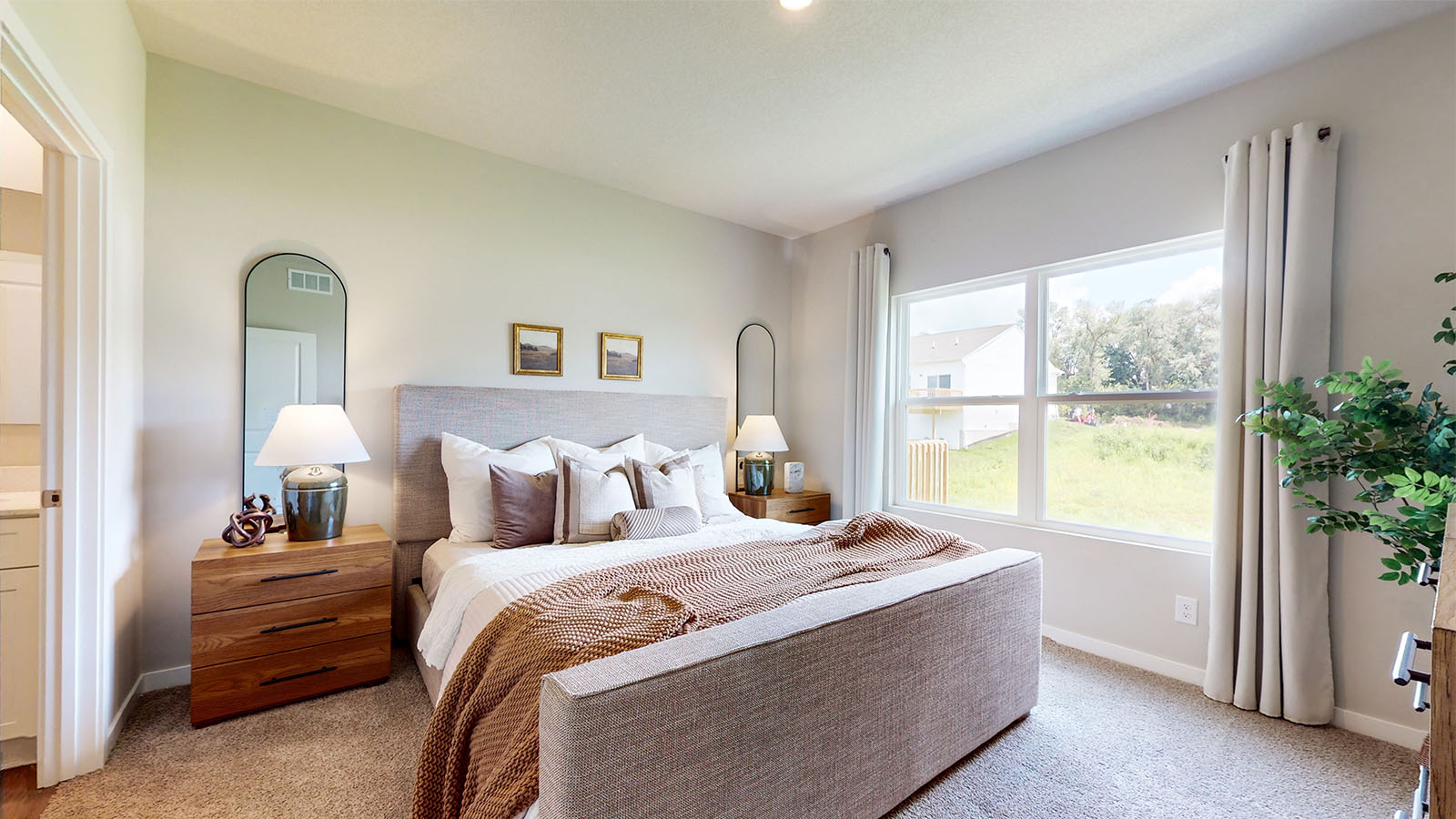 Primary bedroom with large white bed
