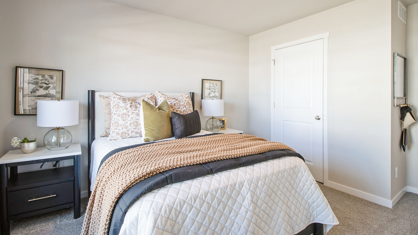 Bedroom with carpeted floors and a closet.