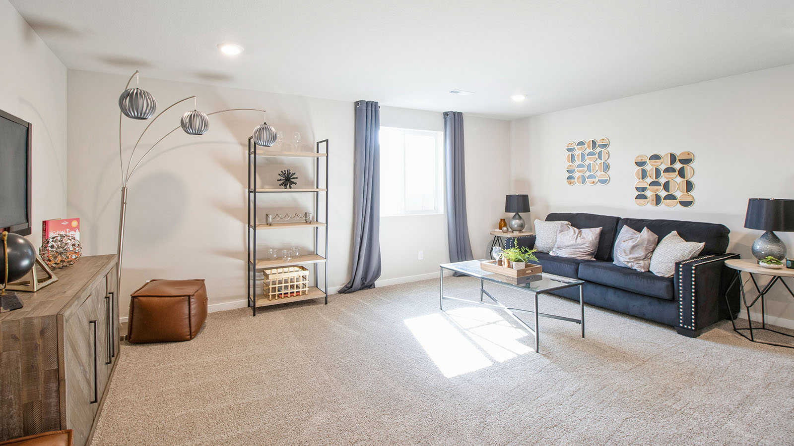 Finished basement with carpeted floors.