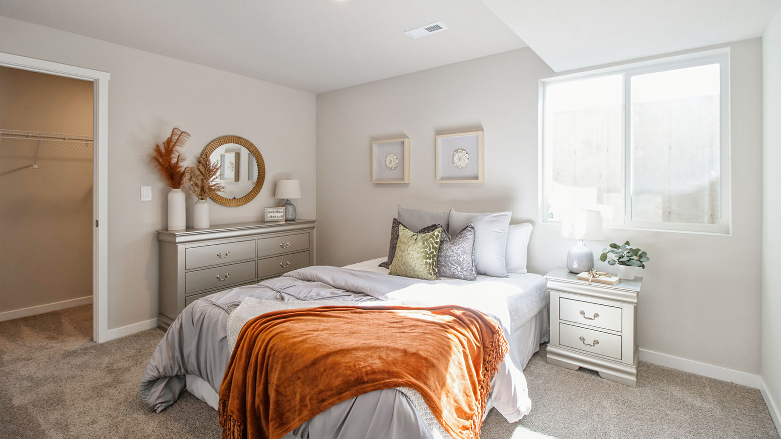 Bedroom in the basement with a window.
