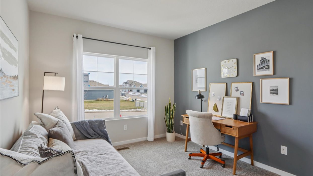 Comfortable secondary bedroom with natural light, modern finishes, and versatile living space.