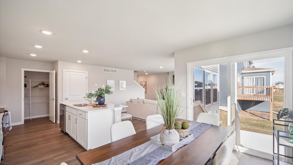 Open concept dining space with access to backyard