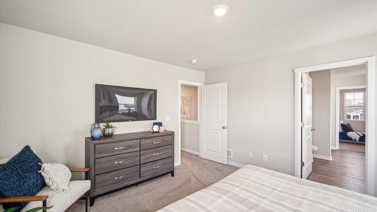 Primary bedroom with natural lighting and spacious layout