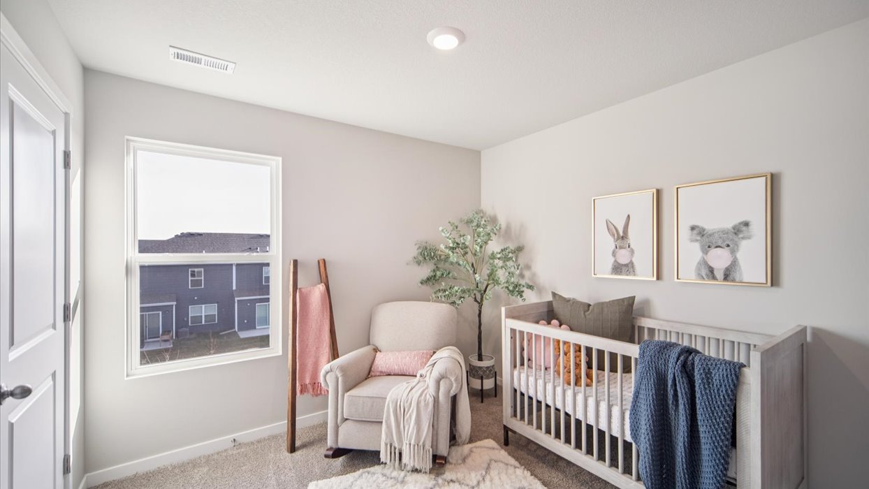Comfortable secondary bedroom with natural light, modern finishes, and versatile living space.