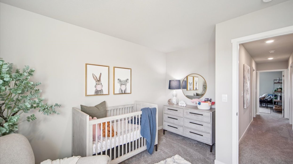 Comfortable secondary bedroom with natural light, modern finishes, and versatile living space.