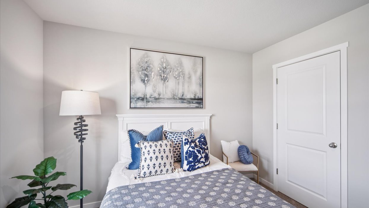 Comfortable secondary bedroom with natural light, modern finishes, and versatile living space.