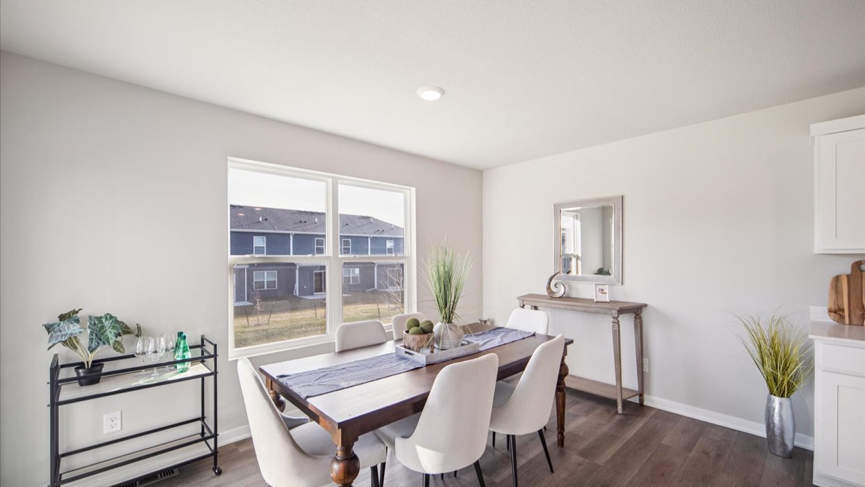 Open concept dining space with access to backyard