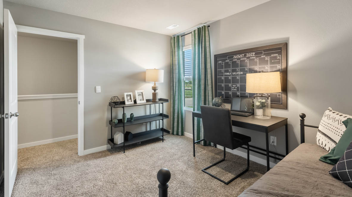 guest bedroom with window letting in natural light