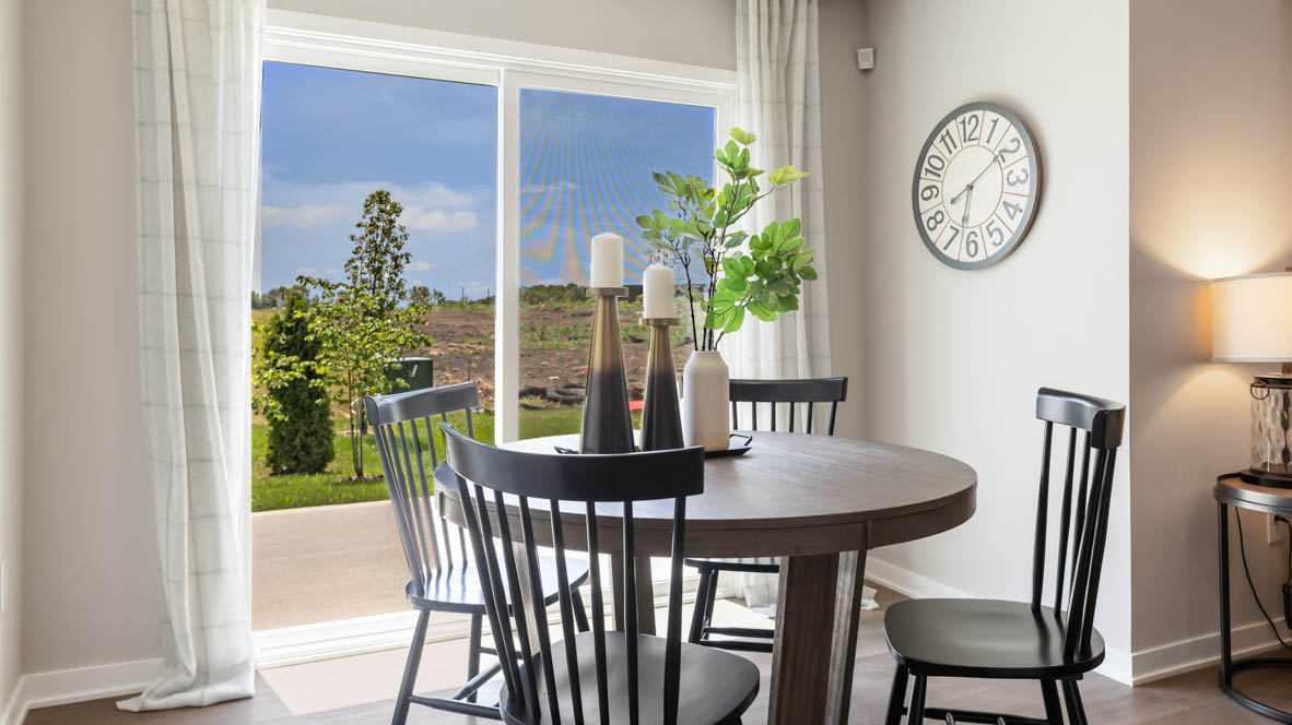 Open concept dining space with access to backyard