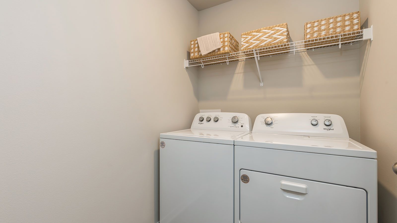 Laundry room with washer and dryer and shelving