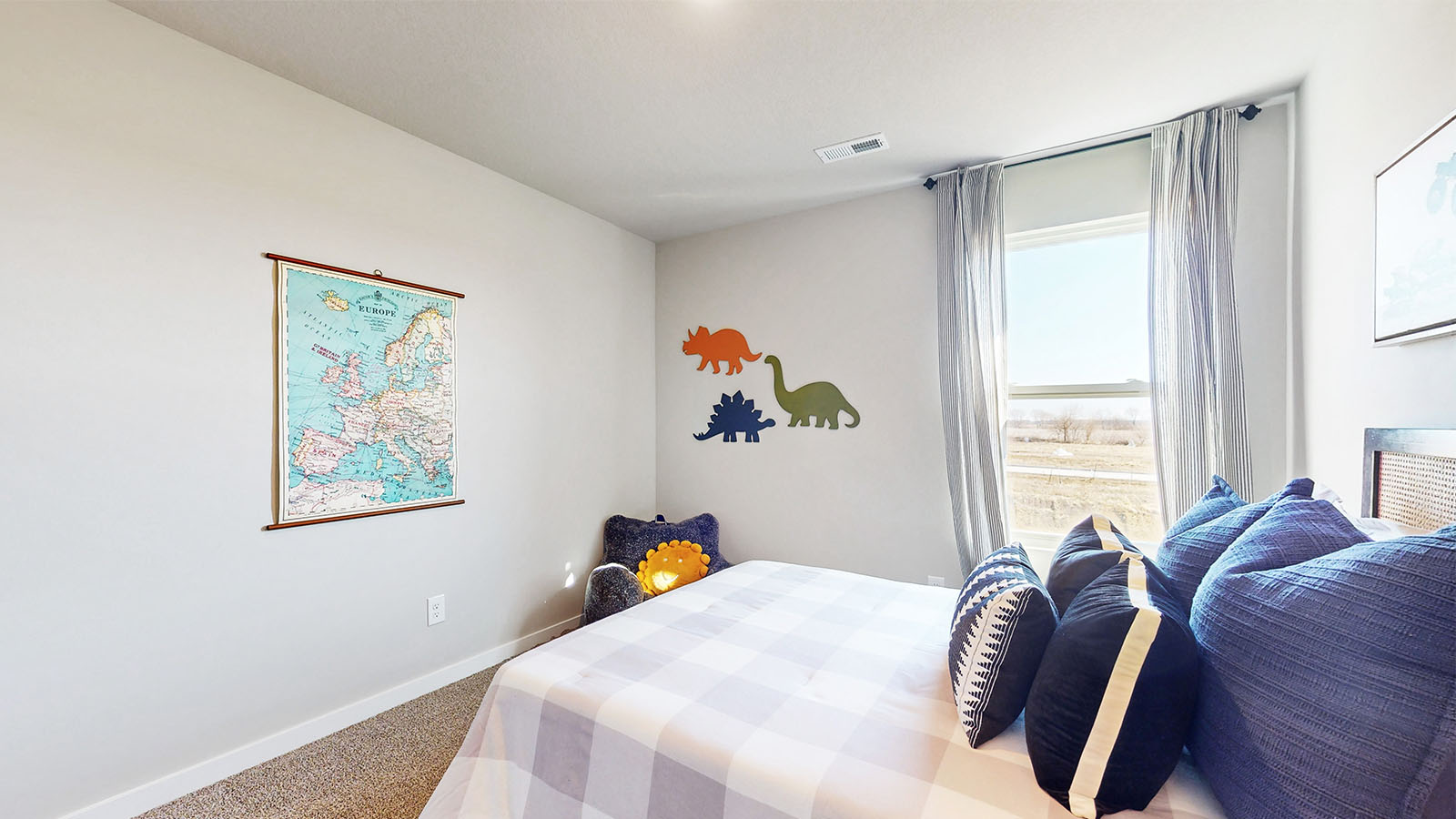 Comfortable secondary bedroom with natural light, modern finishes, and versatile living space.