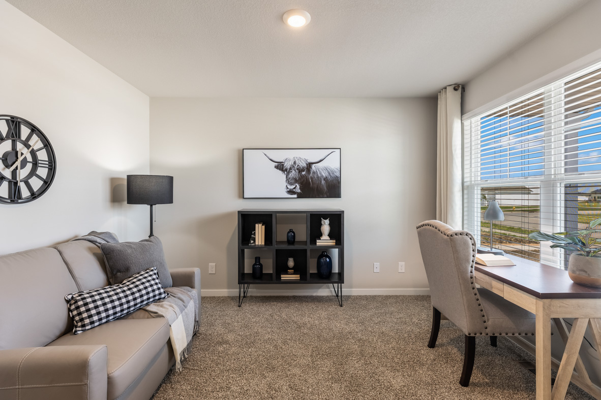 Front office of the bellhaven with a desk and couch