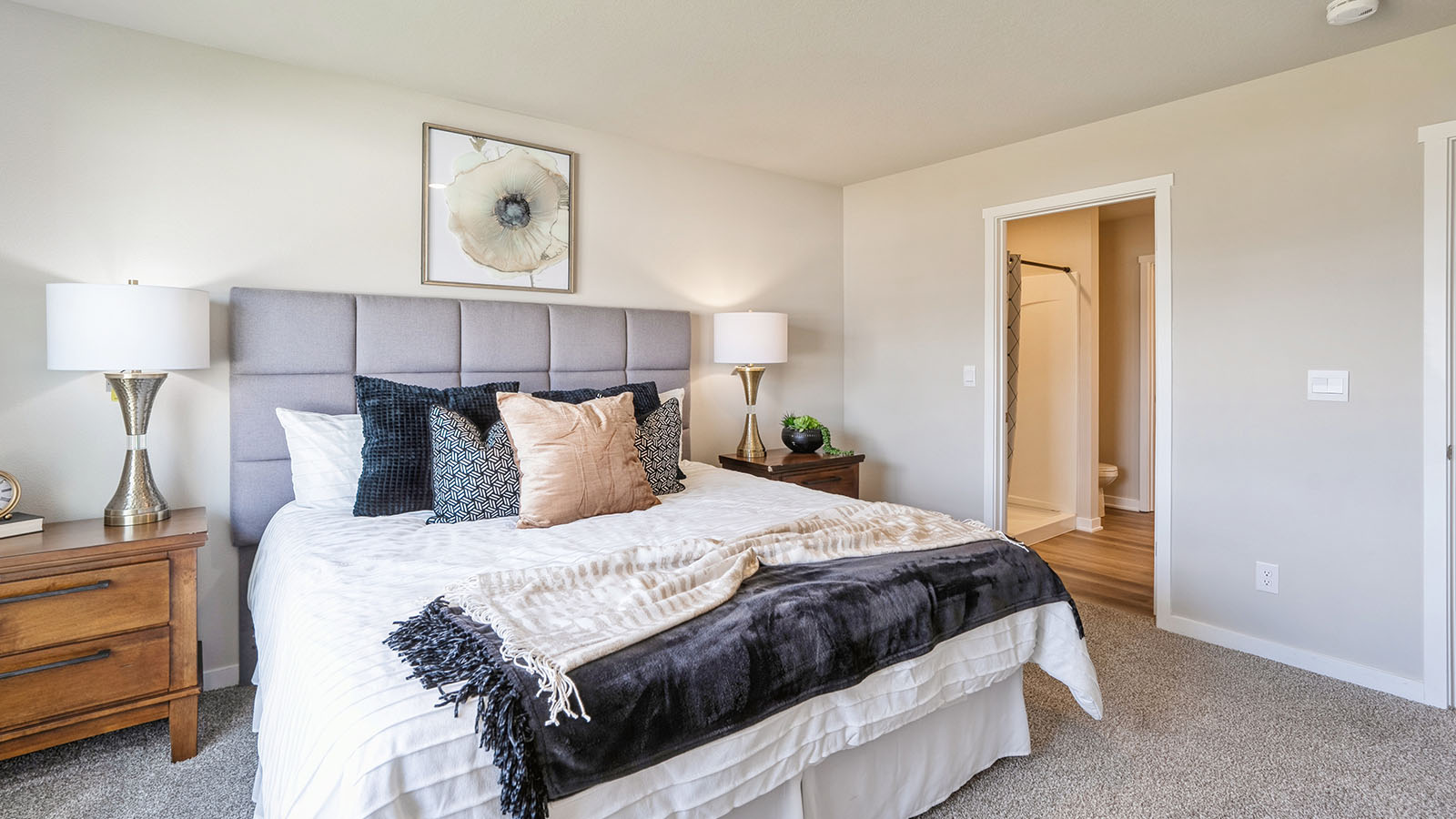 Bedroom with carpeted floors and a window.