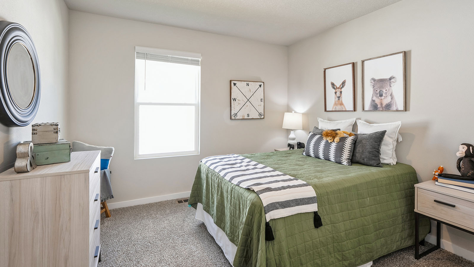 Bedroom with carpeted floors and a window.