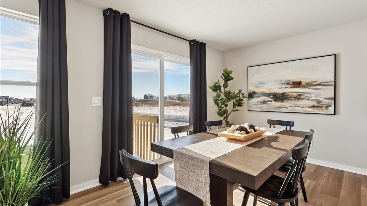 Open concept dining space with access to backyard