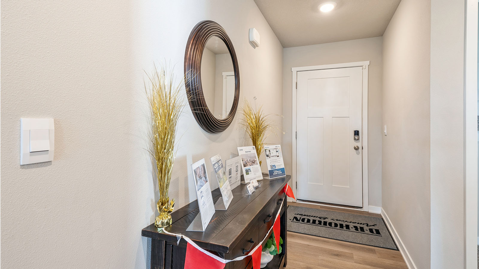 Bright front hallway featuring a welcoming entry space and room for a small table or accents.