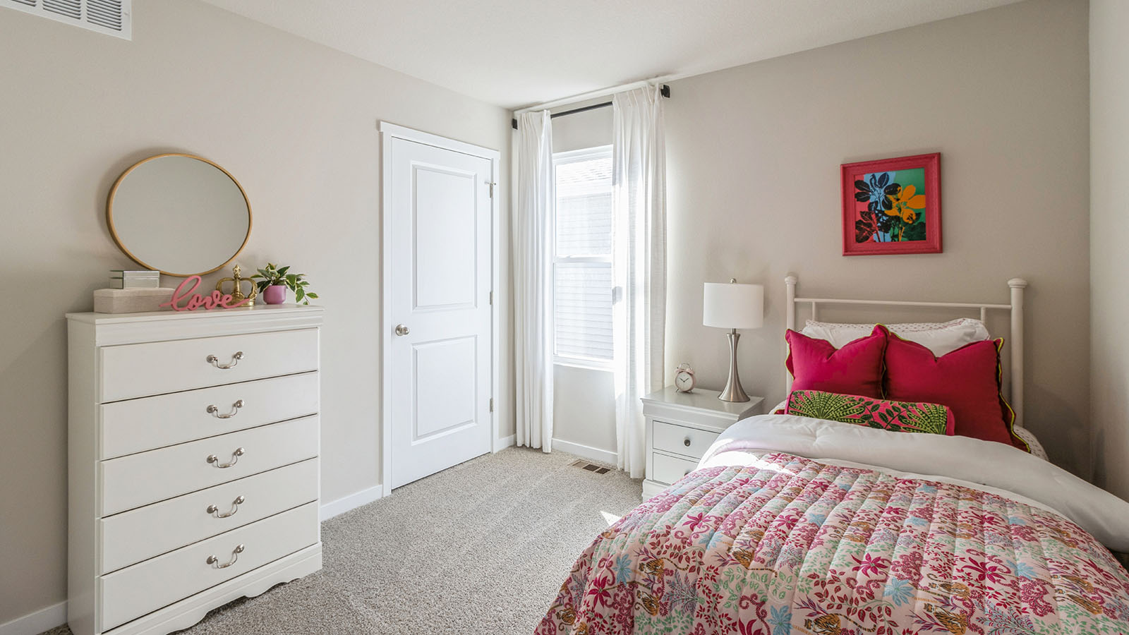 Bedroom 2 with white bed and overhead lighting