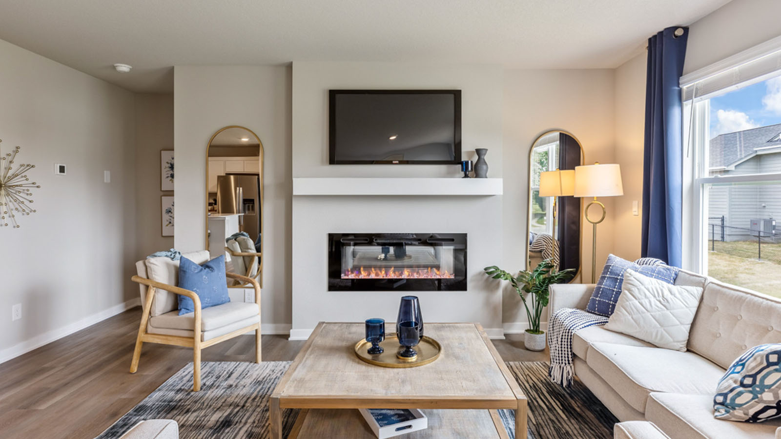 Open concept living room with electric fireplace