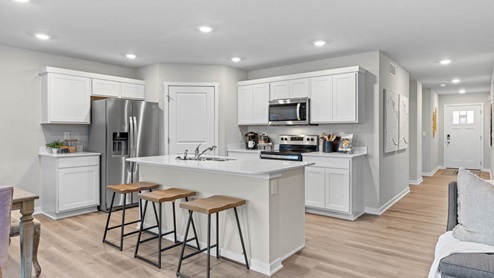open kitchen with stainless-steel appliances