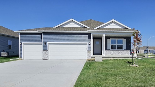 front exterior of hamilton ranch home with 3 car attached garage