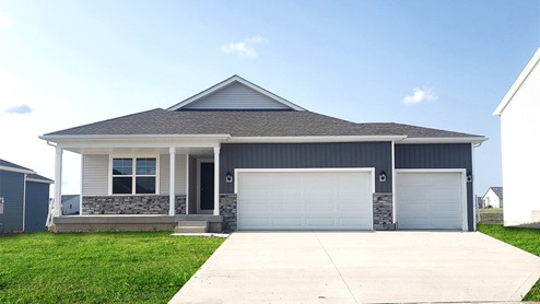 front exterior of hamilton home with 3 car garage