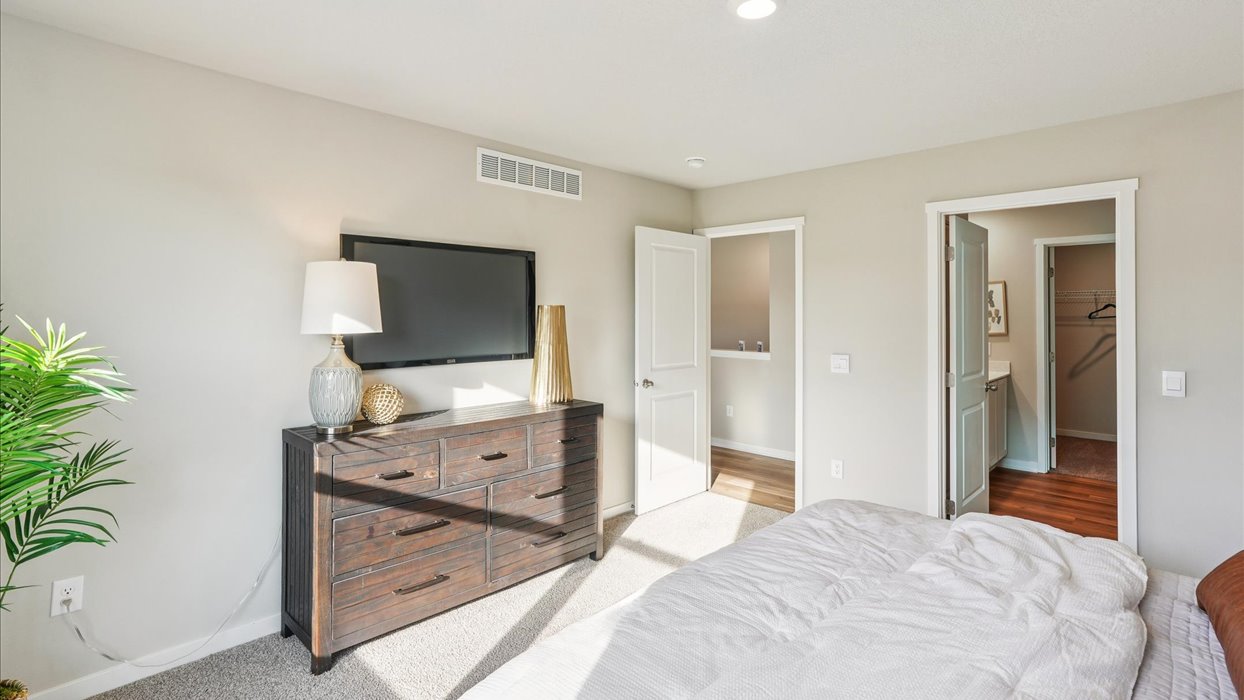 Primary bedroom with natural lighting and spacious layout