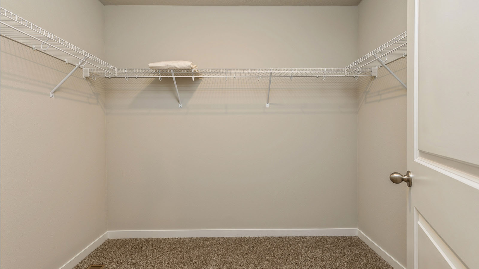 Spacious walk-in closet offering ample room for clothing, accessories, and everyday essentials.