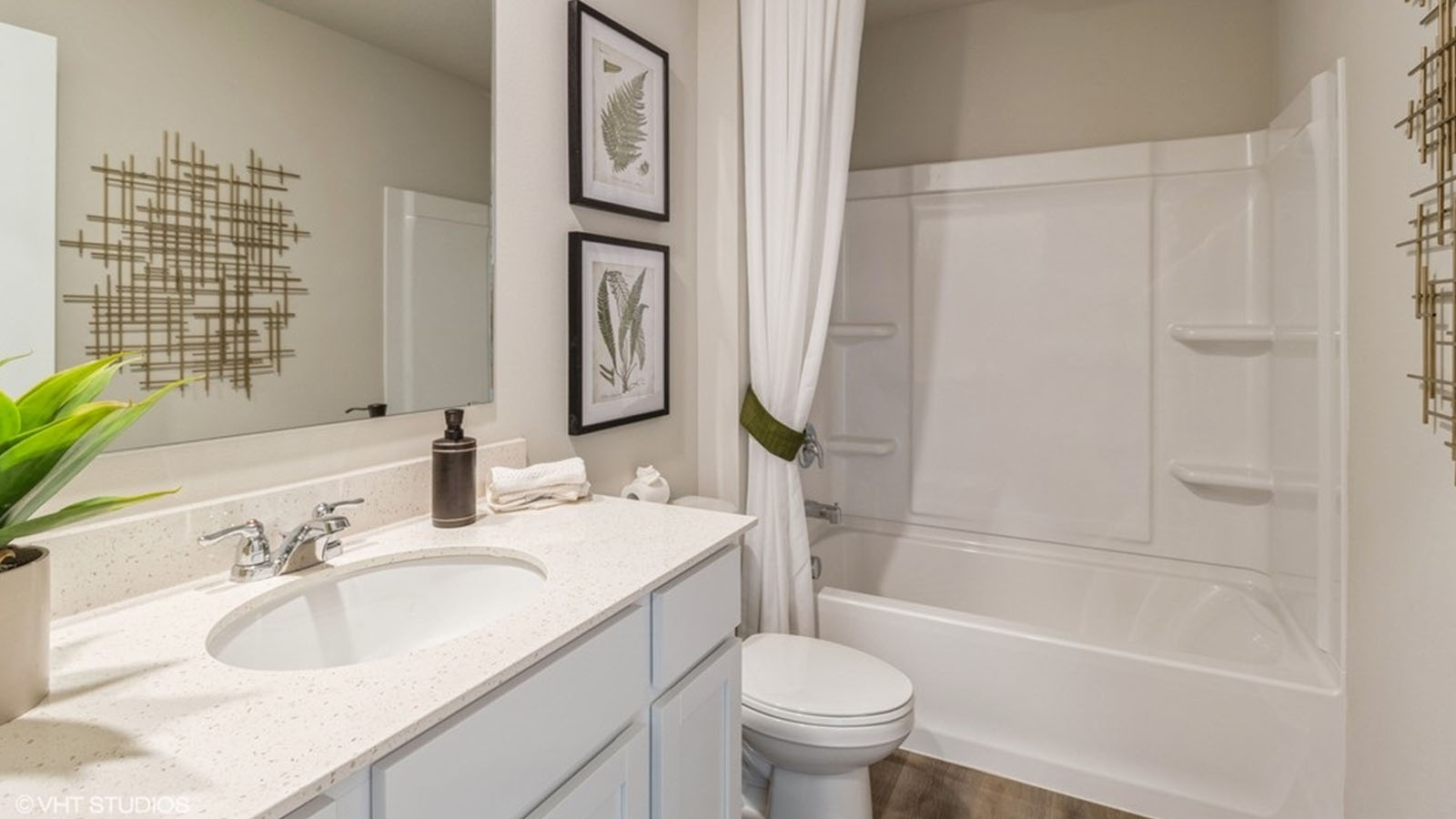 Bathroom with tub and shower combo, quartz countertops, and white vanity