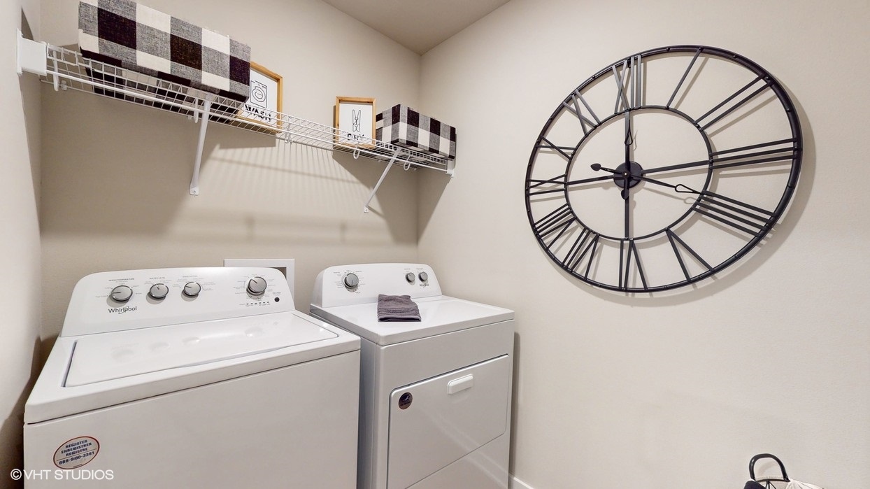 Utility laundry smartly designed with overhead storage, a drop zone, with washer and dryer included