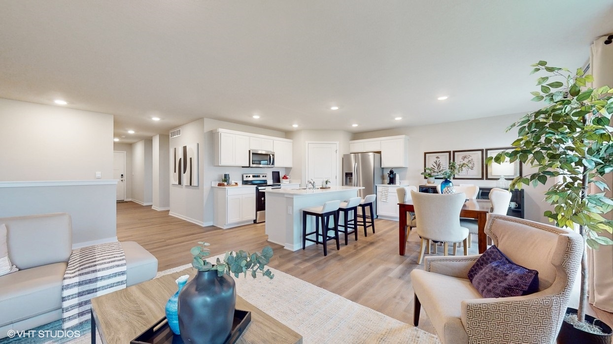 Living room overlooking the Sycamore Heights kitchen and dining room