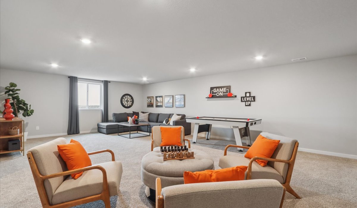 Finished basement living area with comfortable seating space and flexible room for entertaining or relaxing.