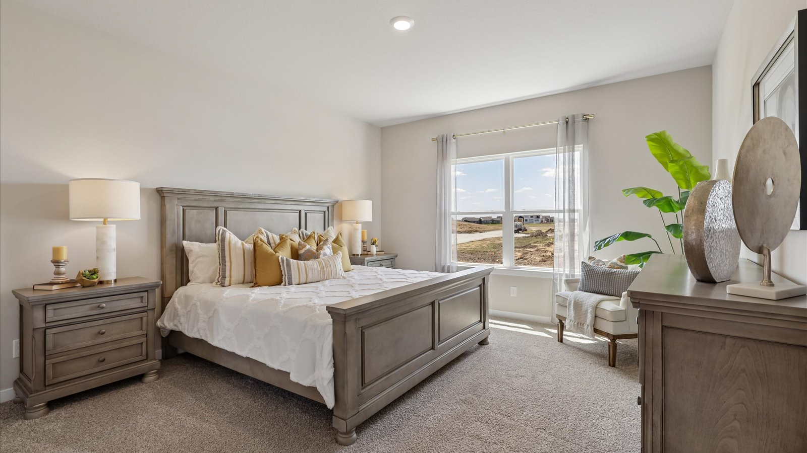 Primary bedroom with natural lighting and spacious layout