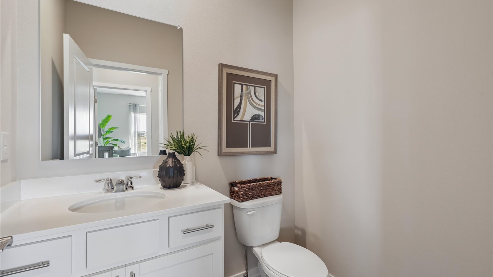 Stylish full bathroom with bright lighting and functional design.