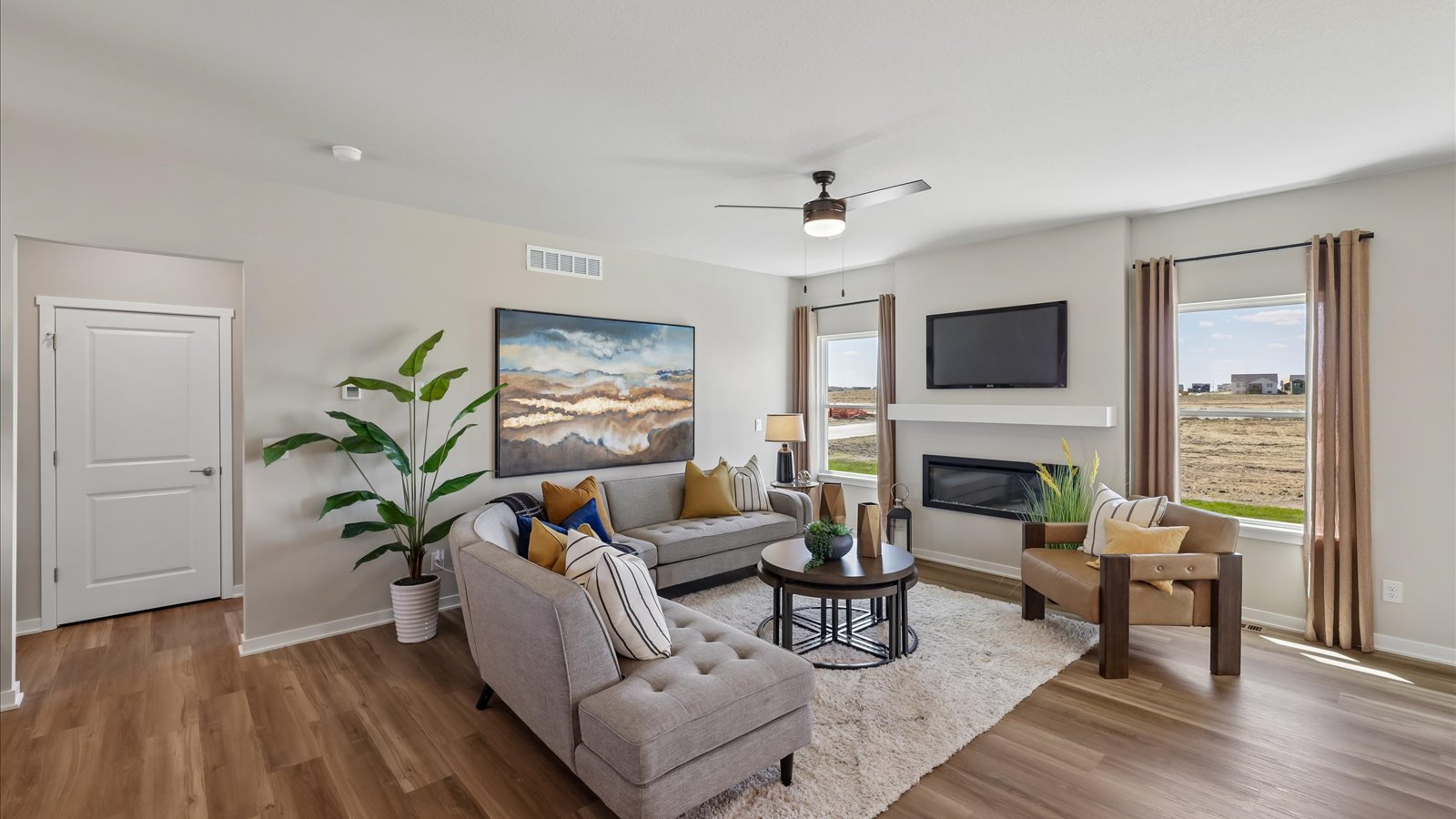 Open concept living room with electric fireplace
