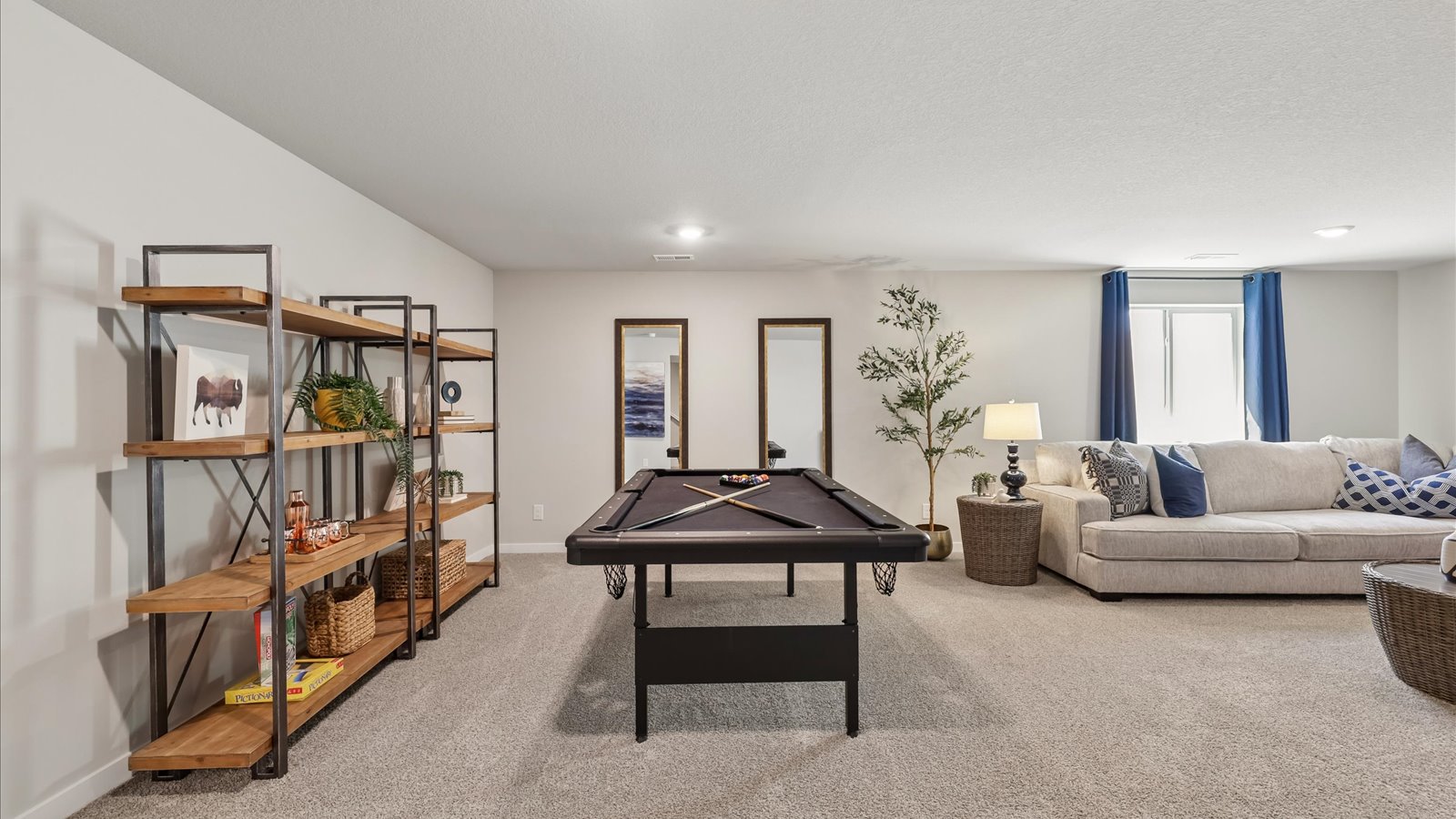 Finished basement living area with comfortable seating space and flexible room for entertaining or relaxing.