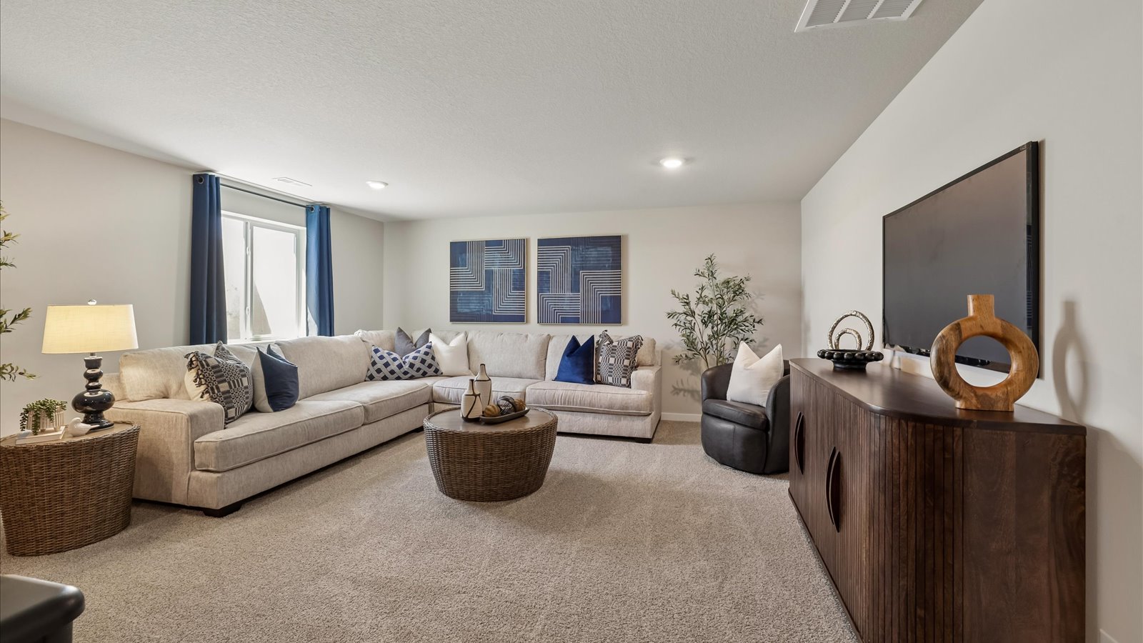 Finished basement living area with comfortable seating space and flexible room for entertaining or relaxing.
