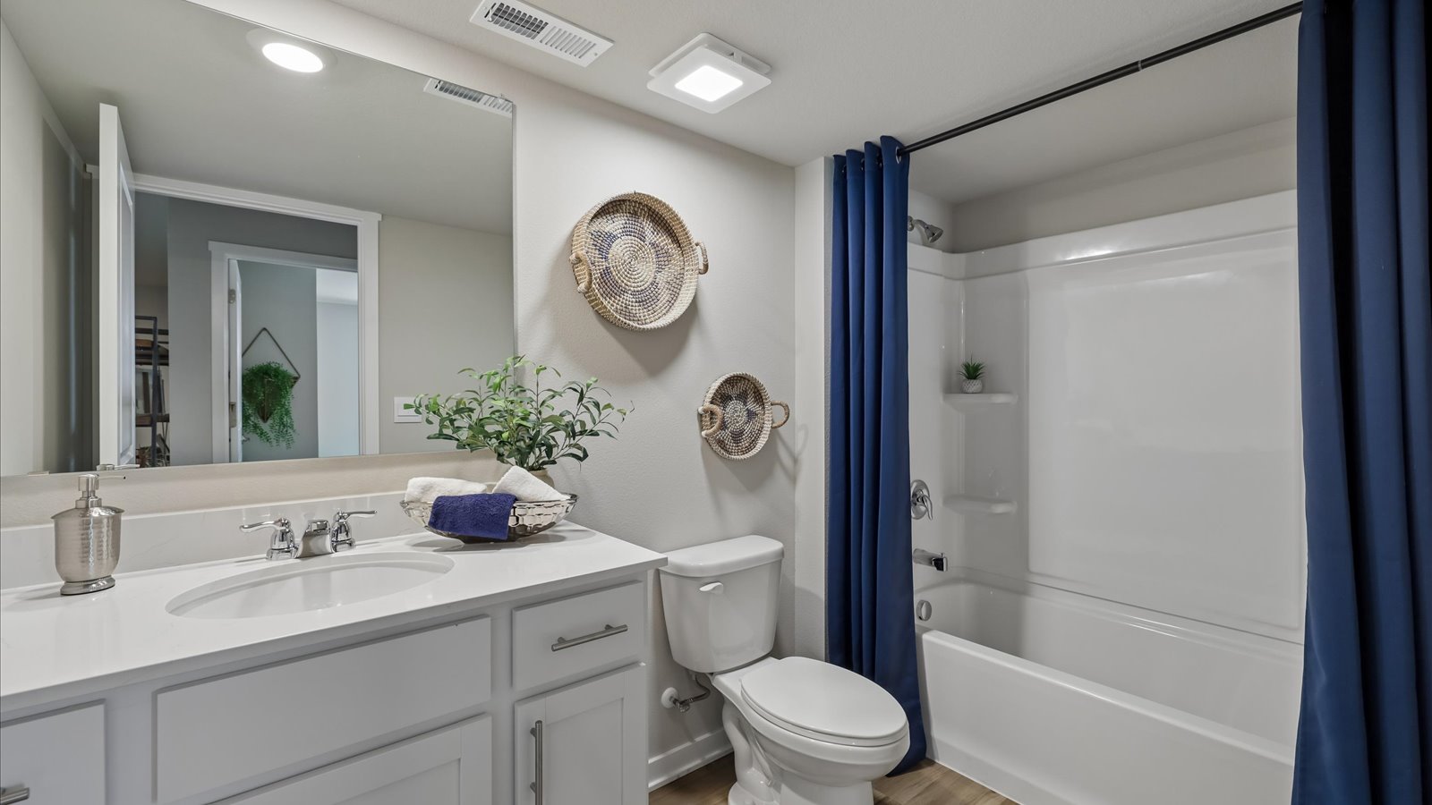Stylish lower-level bathroom featuring contemporary fixtures and convenient access from the finished basement.