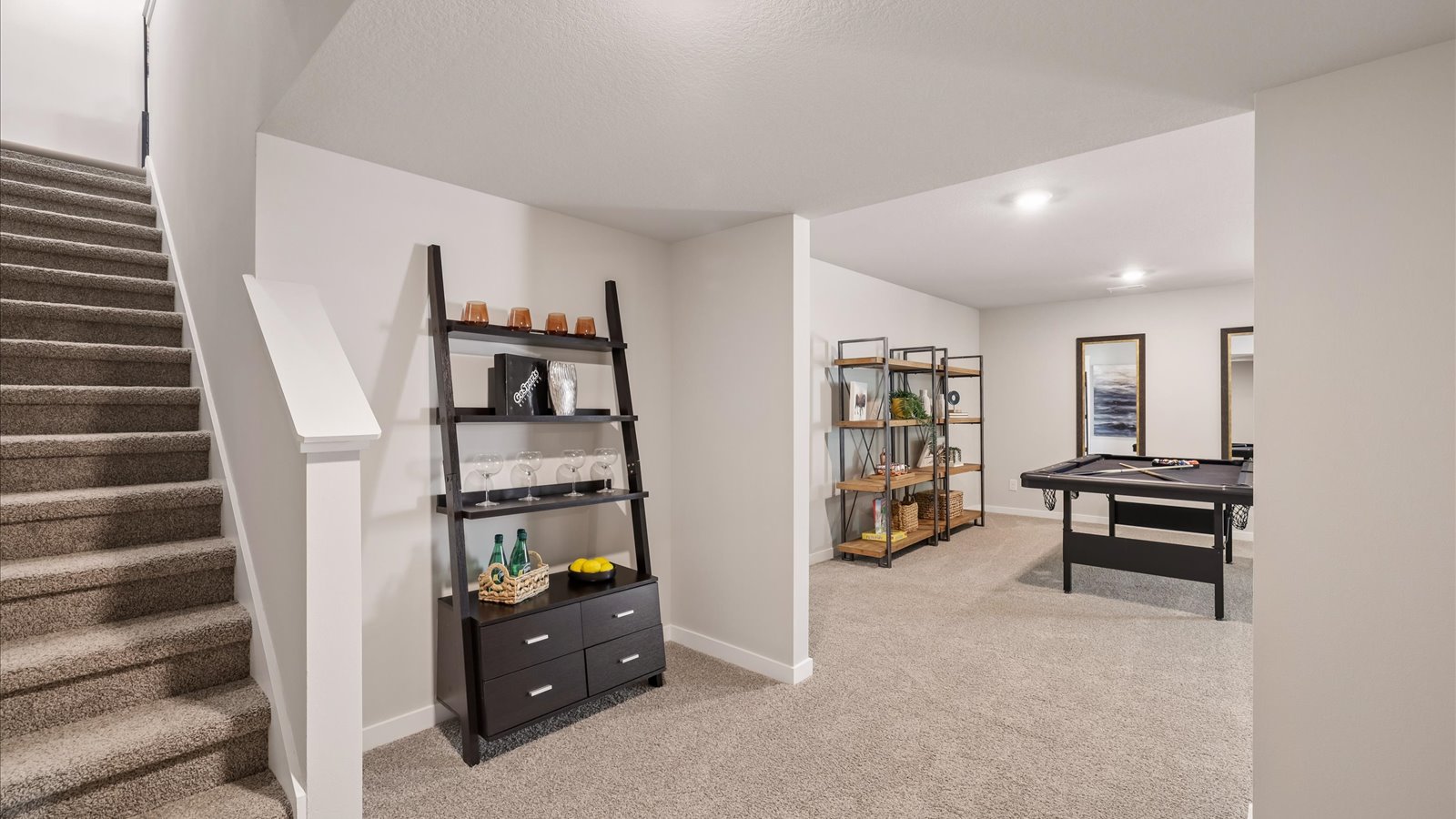 Finished basement living area with comfortable seating space and flexible room for entertaining or relaxing.