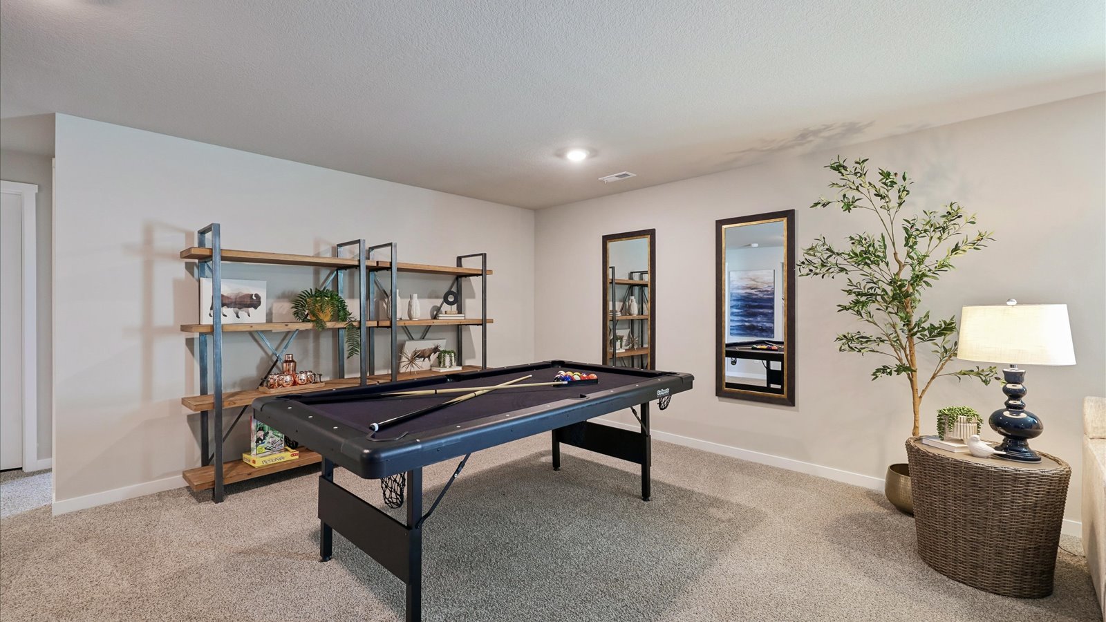 Finished basement living area with comfortable seating space and flexible room for entertaining or relaxing.