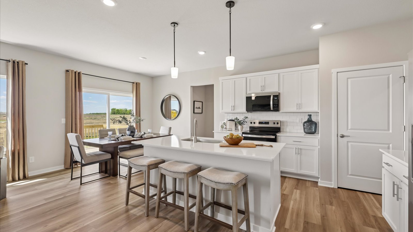 Kitchen with white cabinetry and quartz countertop