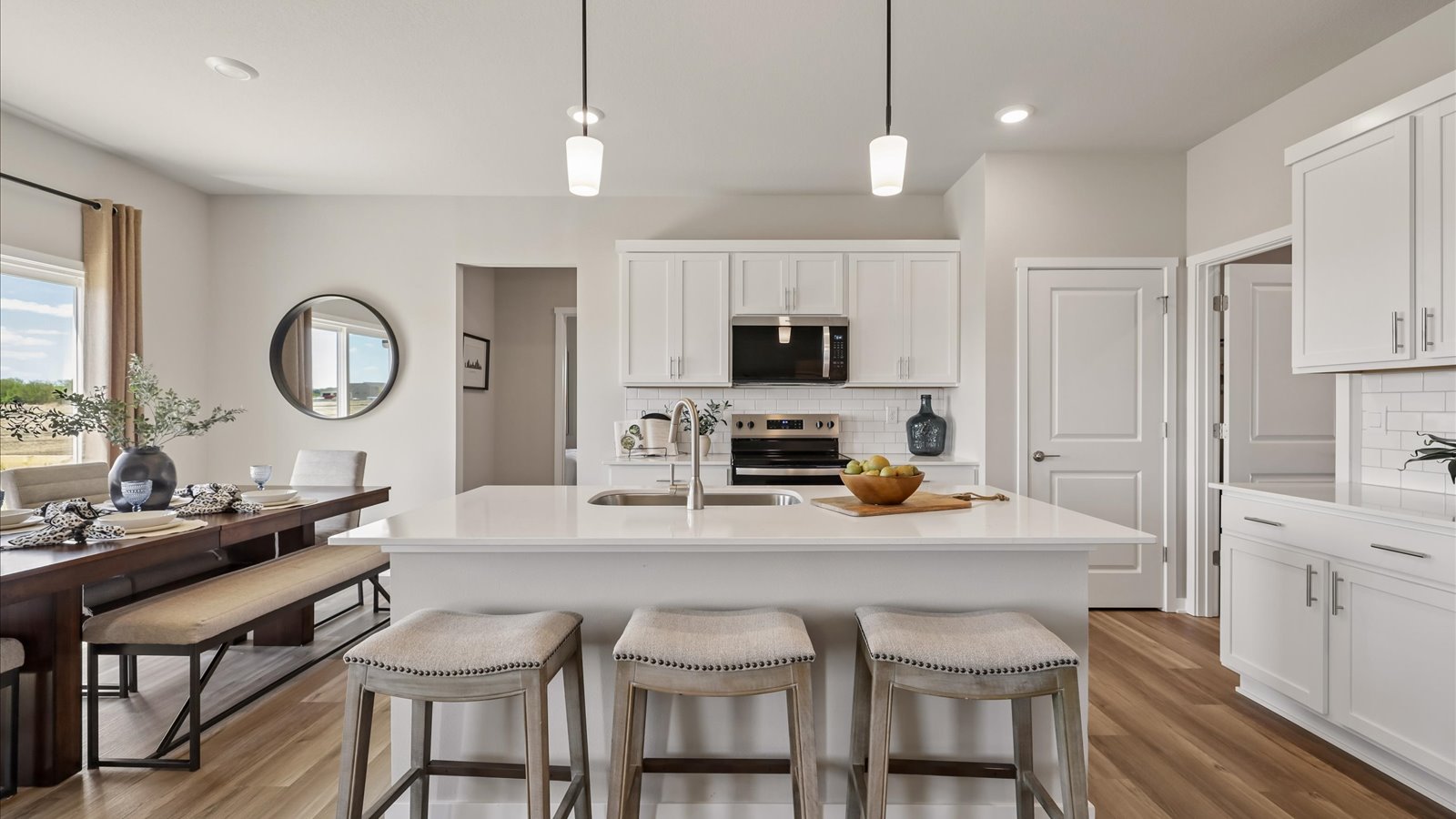 Kitchen with white cabinetry and quartz countertop